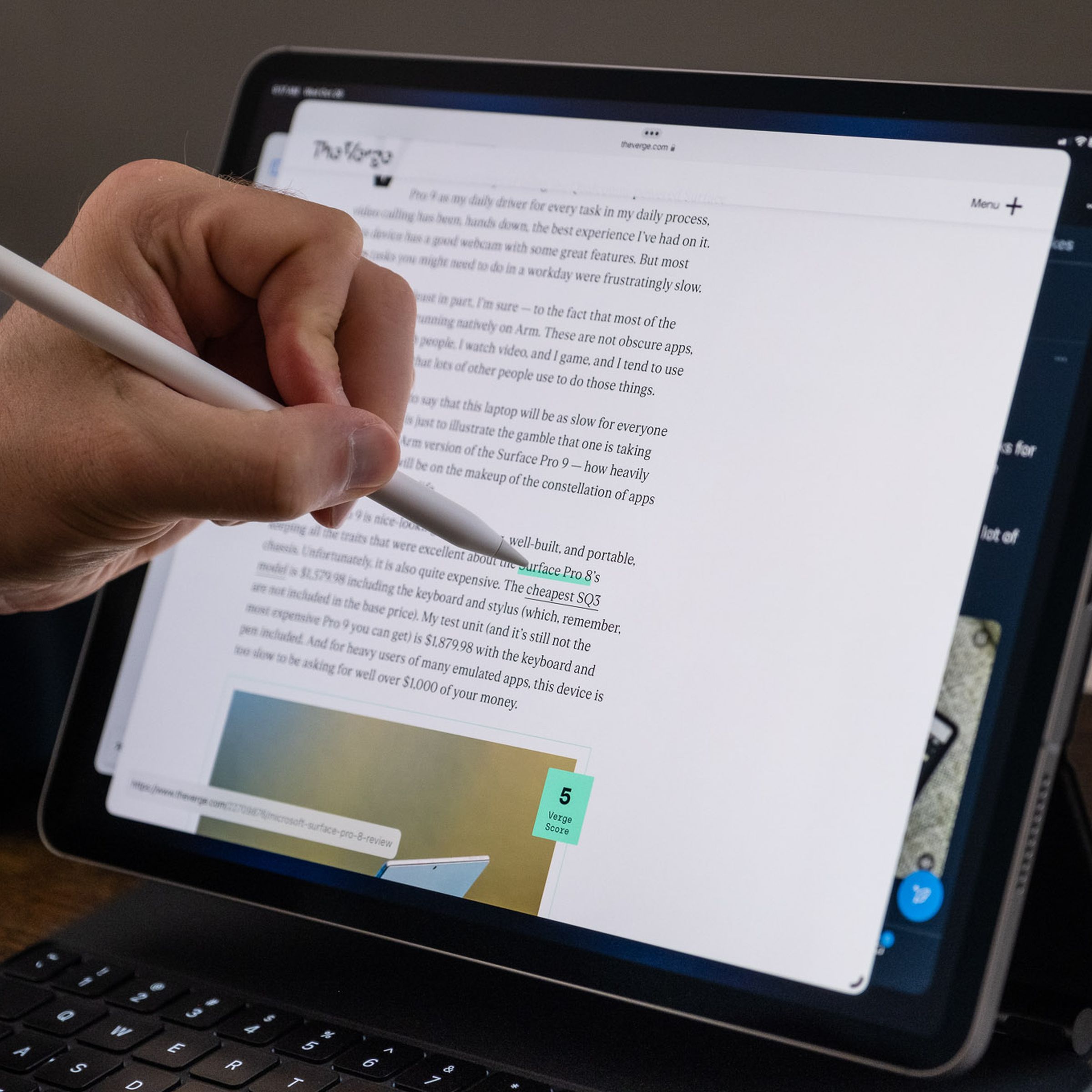 Demonstrating the Pencil hover feature on the 2022 iPad Pro by holding the Pencil over a link and seeing its destination in the lower-left corner.