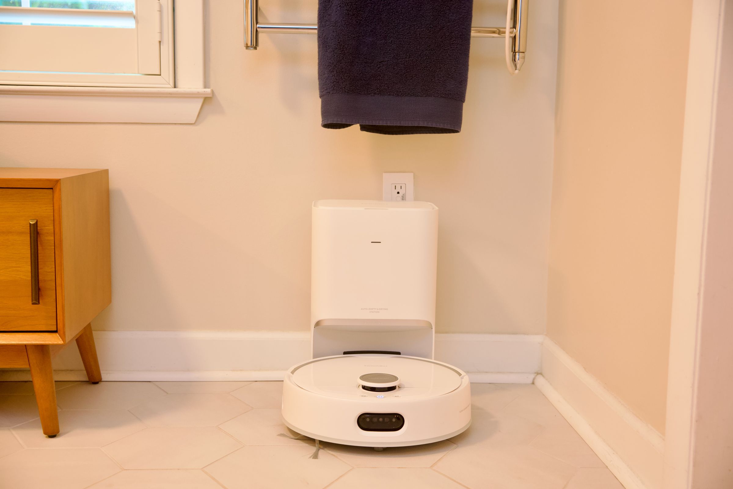 The SwitchBot S10 has two docks, a regular charging station that auto-empties, and a separate water station that can hook into your plumbing.