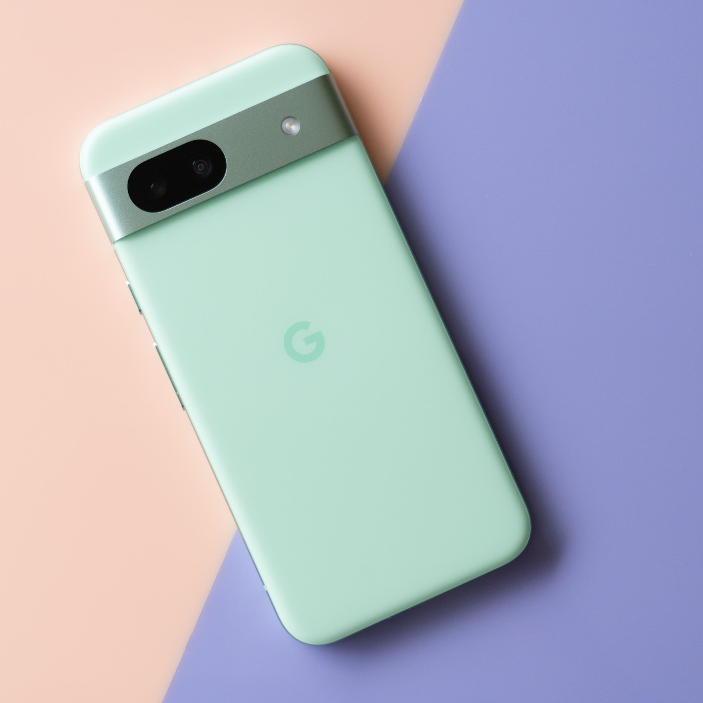 Google Pixel 8A in aloe green showing back panel.