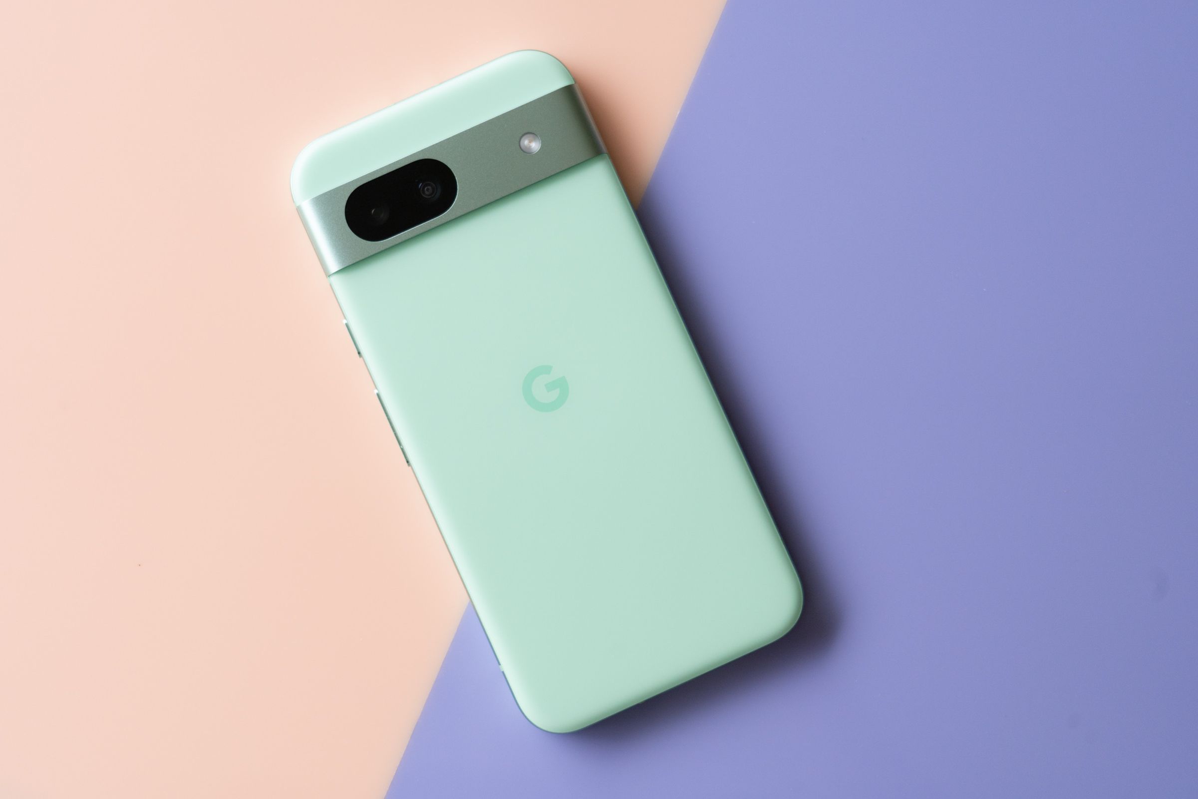 Google Pixel 8A in aloe green showing back panel.