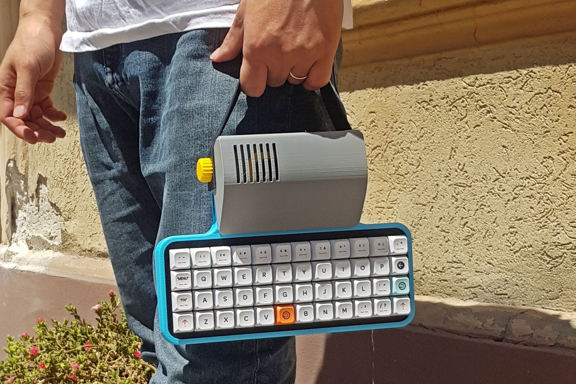 A user carrying the Micro Journal Rev.6 using its leather carrying strap.